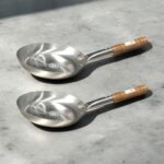 SK Flat Iron Frying Pan with a sleek wooden handle, available in 10, 11, 12, and 13-inch sizes, perfect for versatile cooking