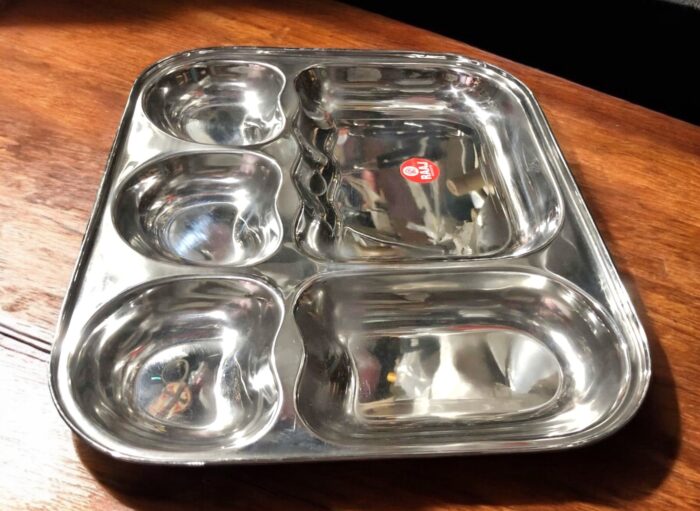 Raj 5-in-1 Apple Shape Bhojan Thal Set of Two featuring a sleek apple-shaped design, five compartments, and premium stainless steel.
