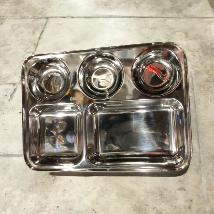 Onam 5-in-1 Bhojan Thal with round design, deep compartments, and heavy-gauge stainless steel for a premium dining experience.