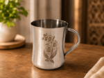 Mayur KM Gold Signature Stainless Steel Cup Set of 4 with elegant gold floral design and mirror-polished finish. Premium 250ml food-grade stainless steel tea and coffee cups for home, dining, gifting, and special occasions.