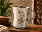Mayur KM Gold Signature Stainless Steel Cup Set of 4 with elegant gold floral design and mirror-polished finish. Premium 250ml food-grade stainless steel tea and coffee cups for home, dining, gifting, and special occasions.