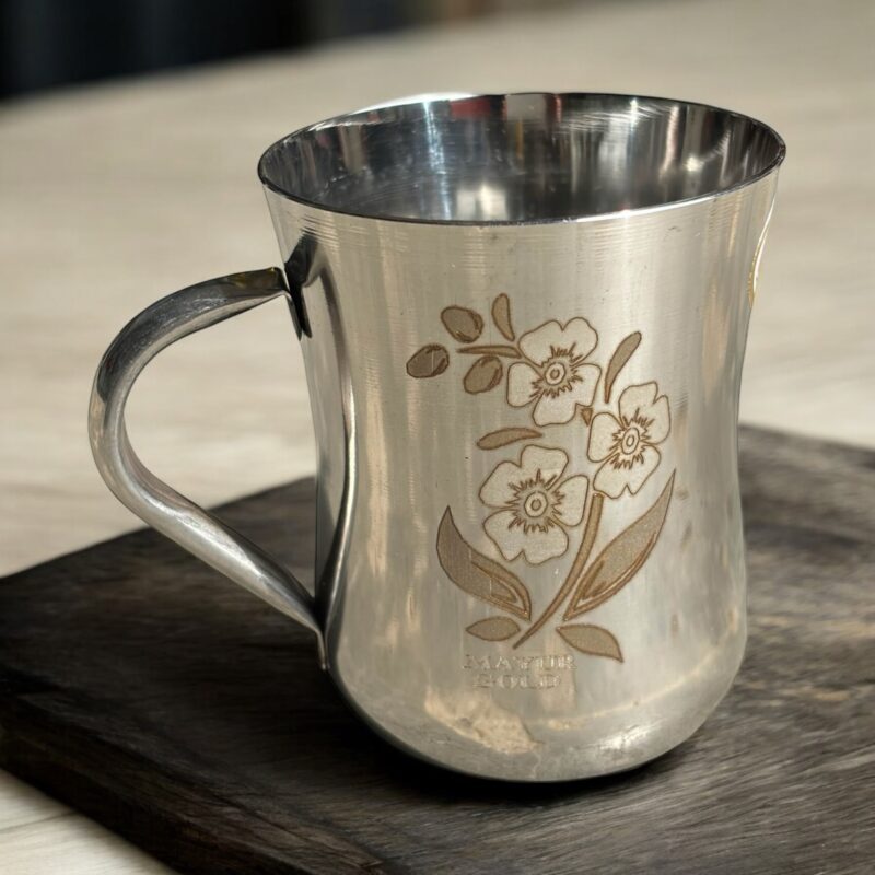 Mayur Gold Signature Stainless Steel Cup Set with a gold flower design, 250 ml capacity per cup, set of 4