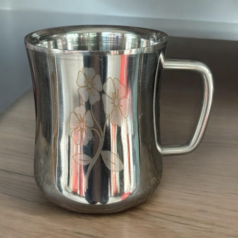 Elevate your drinkware collection with the Tisha Gold Set of 4 Cups. Featuring a sleek double-wall design, these cups keep beverages hot without burning your hands. With a capacity of 300 ml, each cup is perfectly sized for your favorite coffee, tea, or any warm beverage. The cups measure 3.5 inches in length and 2.5 inches in width, making them compact yet stylish. The luxurious gold finish adds a touch of class to any occasion, making this set a must-have for both everyday use and special gatherings. Product Highlights: Double-wall design for superior heat insulation Capacity: 300 ml per cup Size: 3.5" (Length) x 2.5" (Width) Elegant gold finish for a premium, modern look Set of 4 cups, perfect for serving guests or family Suitable for hot and cold beverages Shop now and make your tea or coffee time more elegant!