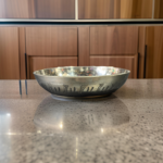 A handcrafted 5-inch WellnessCarve Bronze Cherry Plate, featuring a smooth finish and elegant design, perfect for serving and enhancing traditional dining experiences.