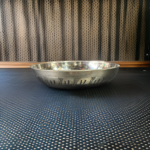 A handcrafted 5-inch WellnessCarve Bronze Cherry Plate, featuring a smooth finish and elegant design, perfect for serving and enhancing traditional dining experiences.