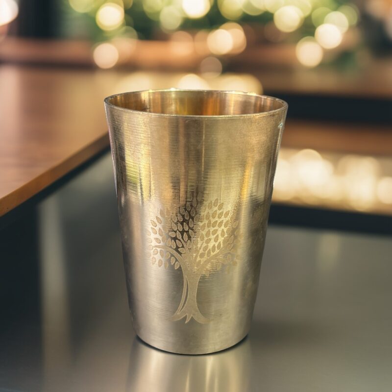 A 7-inch PermaBronze Signature Glass with a smooth bronze finish and elegant design, showcased in a sophisticated setting for timeless appeal