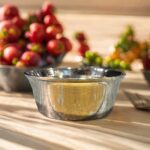 A handcrafted 6.5-inch VitalRoots Bronze Pari Bowl with a smooth finish and elegant design, perfect for serving and promoting healthy dining habits.