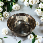 A handcrafted 6.5-inch VitalRoots Bronze Pari Bowl with a smooth finish and elegant design, perfect for serving and promoting healthy dining habits.