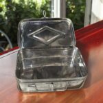 Polished stainless steel jewelry box with a diamond-inspired design, ideal for wedding jewelry storage and bridal gifting.