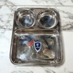 Dolphin TrioServe Bhojan Thal Set of Two made from durable stainless steel, featuring three compartments for organized family meals.