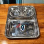 Dolphin TrioServe Bhojan Thal Set of Two made from durable stainless steel, featuring three compartments for organized family meals.