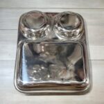 Dolphin TrioServe Bhojan Thal Set of Two made from durable stainless steel, featuring three compartments for organized family meals.