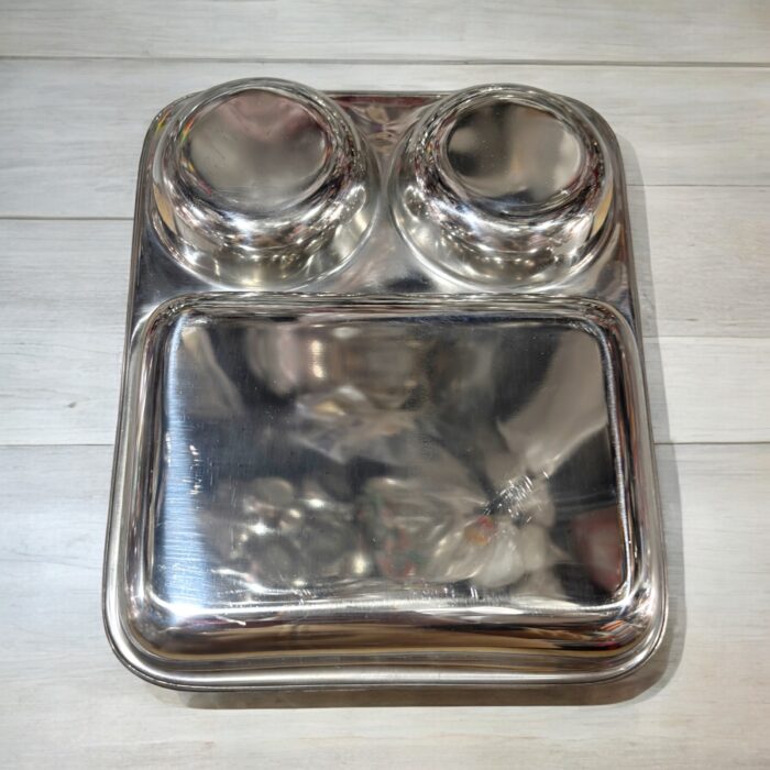 Dolphin TrioServe Bhojan Thal Set of Two made from durable stainless steel, featuring three compartments for organized family meals.