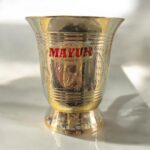 A set of two Mayur EcoSip Floral Brass Glasses (300 ml & 400 ml), featuring an elegant floral engraving, handcrafted from high-quality brass for a luxurious and eco-friendly drinking experience.