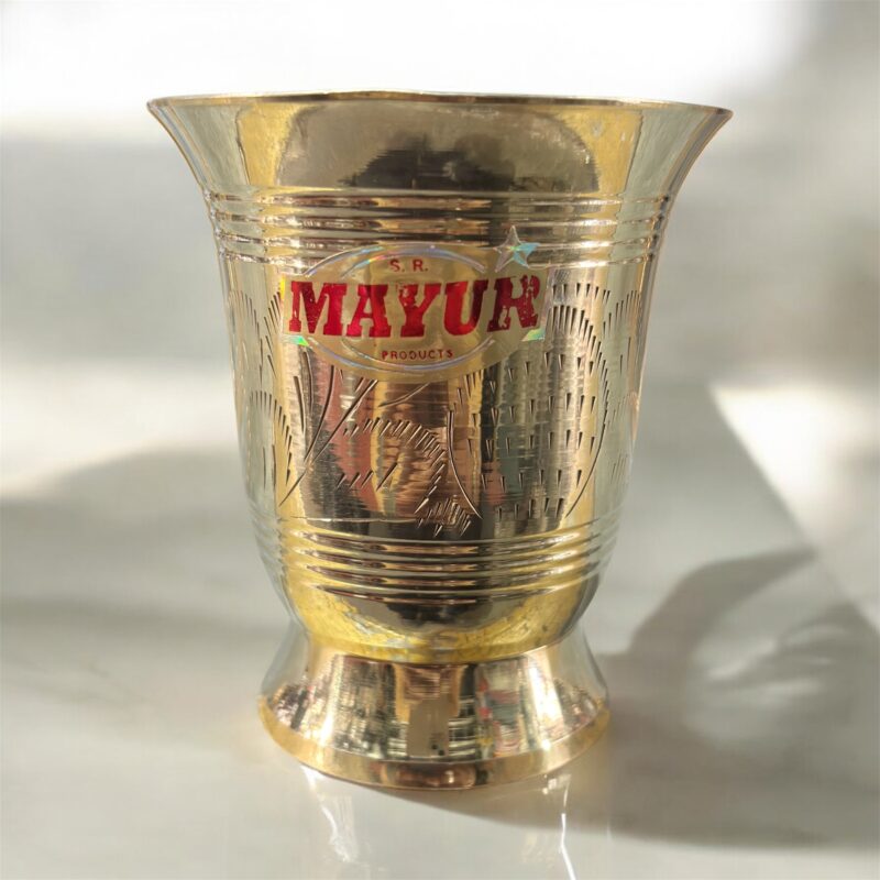 A set of two Mayur EcoSip Floral Brass Glasses (300 ml & 400 ml), featuring an elegant floral engraving, handcrafted from high-quality brass for a luxurious and eco-friendly drinking experience.
