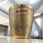 A premium Royal Elegance Brass Tumbler Set (400 ml) with a polished golden finish, handcrafted for luxury gifting and fine dining.