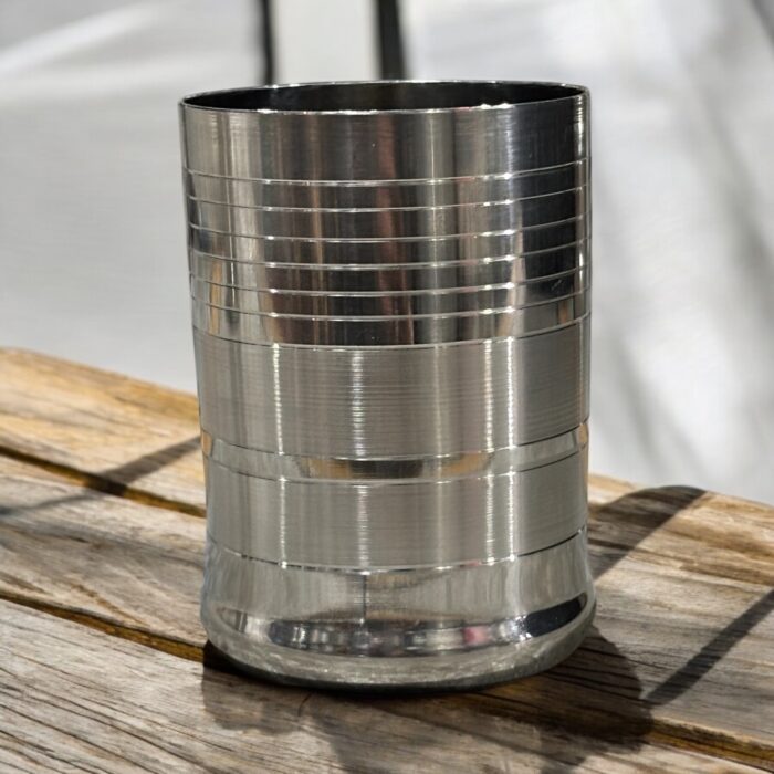 The 301 Hi-Tech Glassi Deep Line Set of 6 (240 ml) offers a durable, eco-friendly, and stylish alternative to plastic and glassware. Made from 100% food-grade stainless steel, these unbreakable glasses are perfect for serving hot or cold beverages while adding a touch of elegance to your drinkware collection.