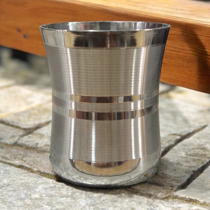 A set of six Saphire Glassi Damru stainless steel glasses (180 ml capacity) with a sleek and durable design, perfect for daily use.