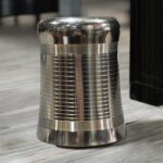 A set of three stainless steel Onam Malbro Glassi Deep Line glasses (180 ml capacity) with a deep-line grip design, placed elegantly on a table