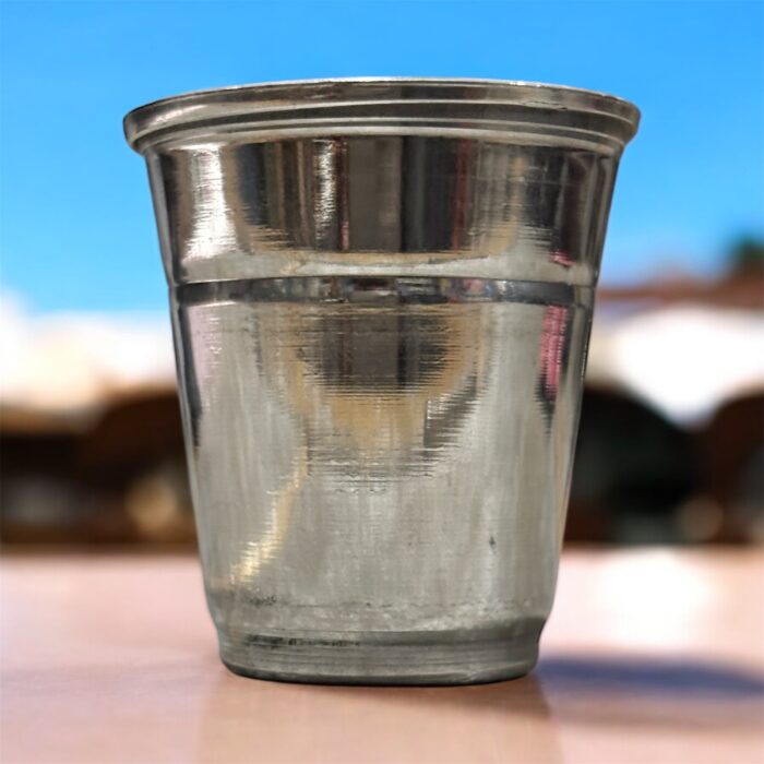 A high-quality stainless steel pooja glass with a 40ml capacity, perfect for offering sacred liquids during worship rituals.