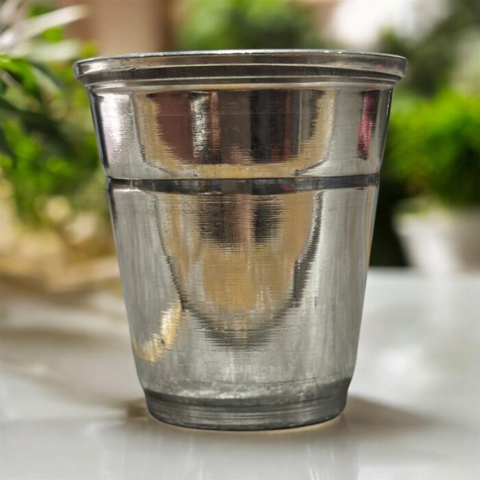 A high-quality stainless steel pooja glass with a 40ml capacity, perfect for offering sacred liquids during worship rituals.