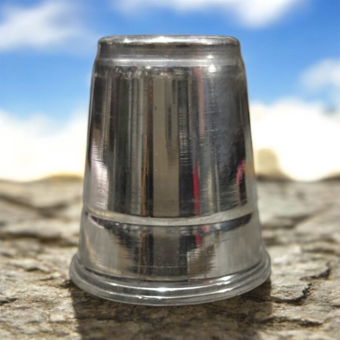 A high-quality stainless steel pooja glass with a 40ml capacity, perfect for offering sacred liquids during worship rituals.