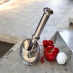 Stainless Steel Natraj Khal Batta (Mortar and Pestle) set in two sizes for grinding spices and herbs.