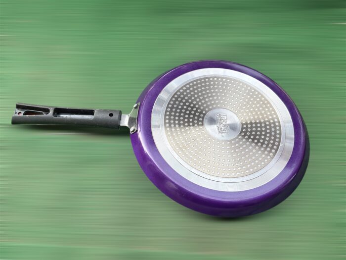 Top view of Pooja 25 cm hard anodized dosa tawa with induction base, featuring a thick 2.8 mm non-stick surface and ergonomic handle.