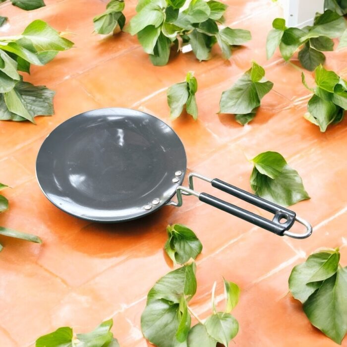 Close-up of Onam 220 mm non-stick roti tawa with induction-compatible base and thick 4.06 mm body, ideal for compact kitchens.