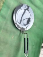Close-up of Onam 220 mm non-stick roti tawa with induction-compatible base and thick 4.06 mm body, ideal for compact kitchens.
