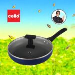 Blue non-stick induction fry pan with glass lid and long handle, shown on a modern kitchen counter; suitable for gas and induction stoves.