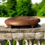 A handcrafted flat wooden chakla made from premium hardwood, designed for rolling rotis, puris, and other Indian breads with ease and stability.