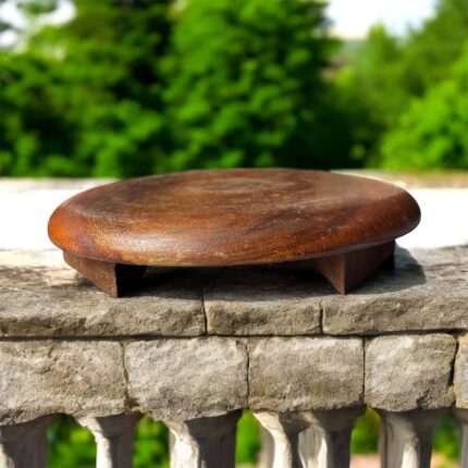 A handcrafted flat wooden chakla made from premium hardwood, designed for rolling rotis, puris, and other Indian breads with ease and stability.