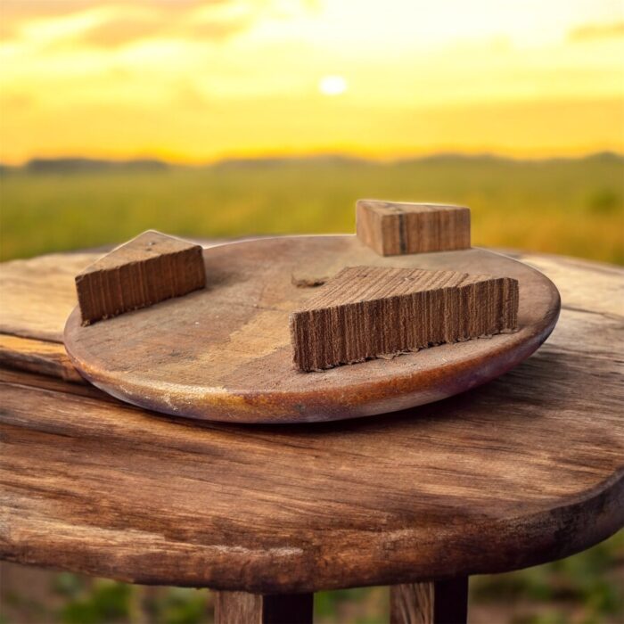 A handcrafted flat wooden chakla made from premium hardwood, designed for rolling rotis, puris, and other Indian breads with ease and stability.