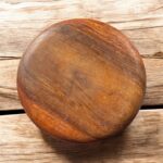 A handcrafted flat wooden chakla made from premium hardwood, designed for rolling rotis, puris, and other Indian breads with ease and stability.