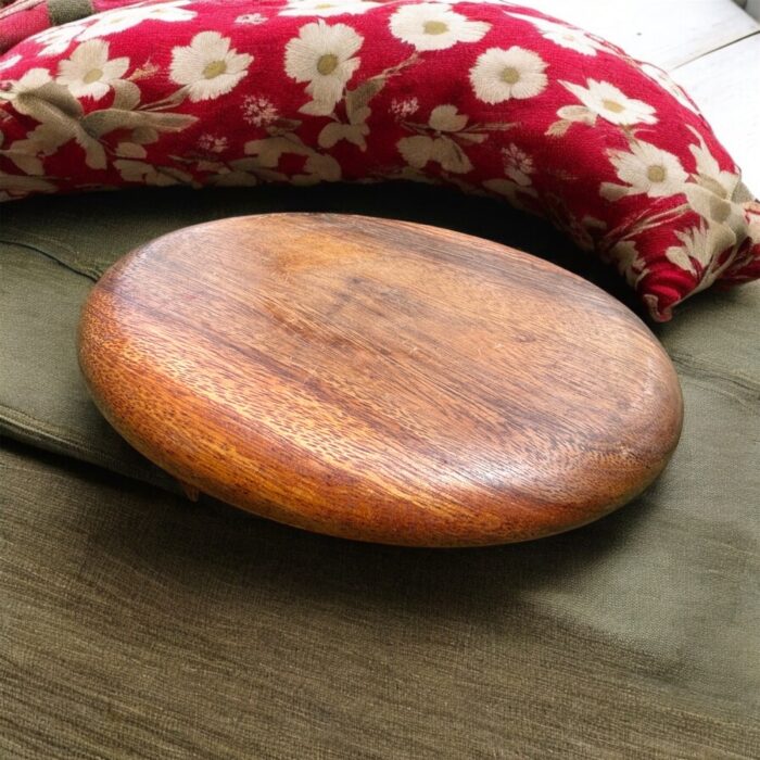 A handcrafted flat wooden chakla made from premium hardwood, designed for rolling rotis, puris, and other Indian breads with ease and stability.