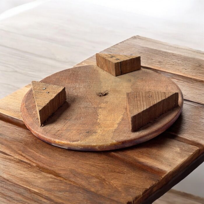 A handcrafted flat wooden chakla made from premium hardwood, designed for rolling rotis, puris, and other Indian breads with ease and stability.