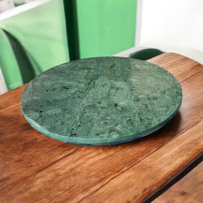 A luxurious black marble chakla with a smooth rolling surface and sturdy anti-slip base, perfect for making rotis, puris, and more in style.