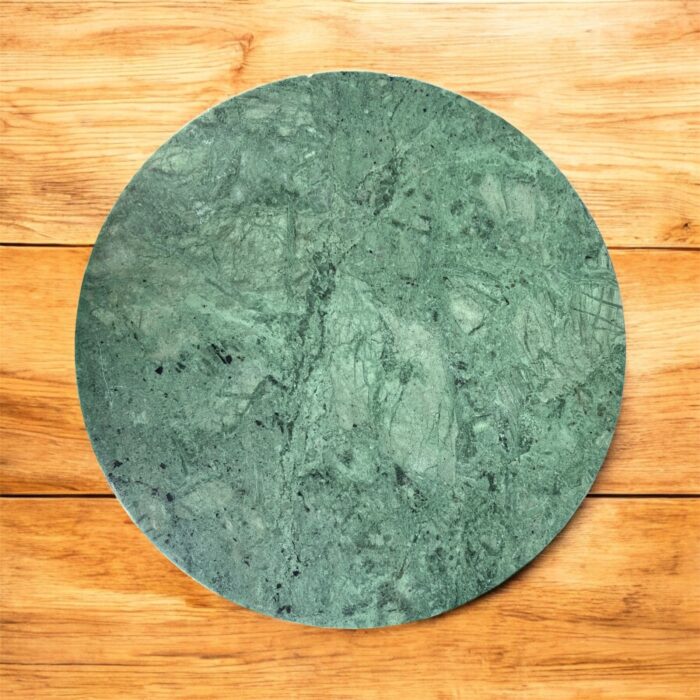 A luxurious black marble chakla with a smooth rolling surface and sturdy anti-slip base, perfect for making rotis, puris, and more in style.