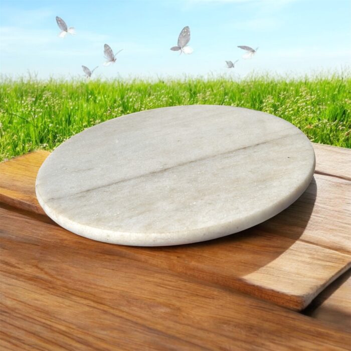 A lightweight white marble roti chakla with a smooth surface, designed for easy handling and effortless rolling of rotis and puris.