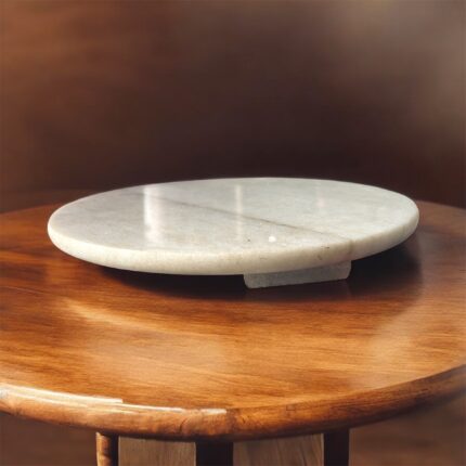 A lightweight white marble roti chakla with a smooth surface, designed for easy handling and effortless rolling of rotis and puris.