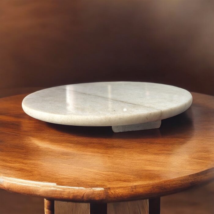 A lightweight white marble roti chakla with a smooth surface, designed for easy handling and effortless rolling of rotis and puris.