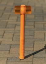 Orange rubber mallet hammer placed on wooden planks beside work gloves and tools, ideal for woodworking, carpentry, and furniture assembly – RRS ShockGuard™ 50mm/60mm.