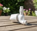 White PVC outdoor garden water tap with long neck and hose connector mounted on wall, ideal for garden watering, car washing and outdoor utility use.
