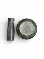 Natural stone mortar and pestle (khal batta) 4 inch wide with 4.5 inch pestle for grinding spices, herbs, and pooja materials in traditional kitchen setting.