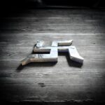 Mirror-finish stainless steel Shubh Swastik wall décor for Vastu, suitable for main door entrance, Griha Pravesh, Diwali decoration, and shop inauguration, available in 10 inch and 12 inch sizes.