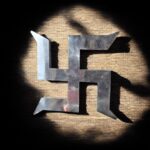 Mirror-finish stainless steel Shubh Swastik wall décor for Vastu, suitable for main door entrance, Griha Pravesh, Diwali decoration, and shop inauguration, available in 10 inch and 12 inch sizes.