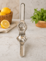 Premium stainless steel lemon squeezer by Neelu, 7.5 inch manual citrus juicer placed on wooden board with fresh lemon in background