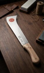 Heavy-duty South Indian darat with a curved sharp steel blade and wooden handle, designed for farming, plantation work, bush clearing, and agricultural cutting tasks.