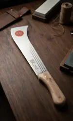 Heavy-duty South Indian darat with a curved sharp steel blade and wooden handle, designed for farming, plantation work, bush clearing, and agricultural cutting tasks.